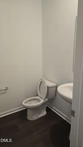a bathroom with a toilet and a sink