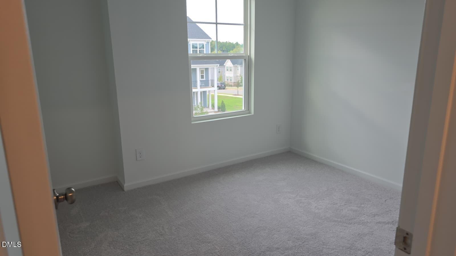 1443 Jay Road Knightdale, NC 27545 - Photo 32 of 46 an empty room with windows