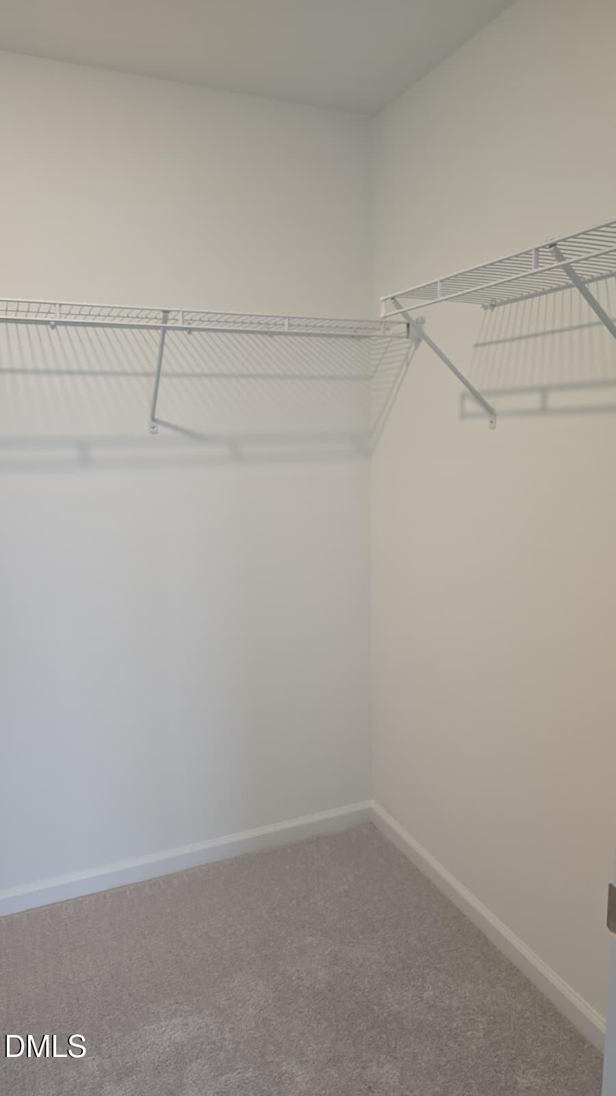 1443 Jay Road Knightdale, NC 27545 - Photo 35 of 46 a view of a room with racks on the wall