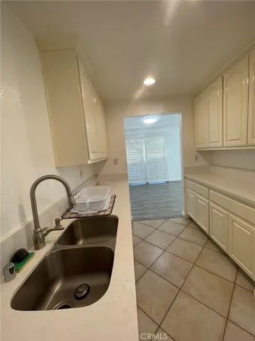 a kitchen with a sink and cabinets