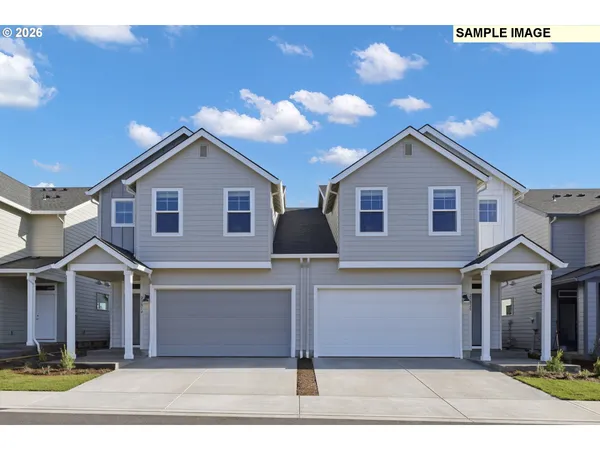 a front view of a house with yard
