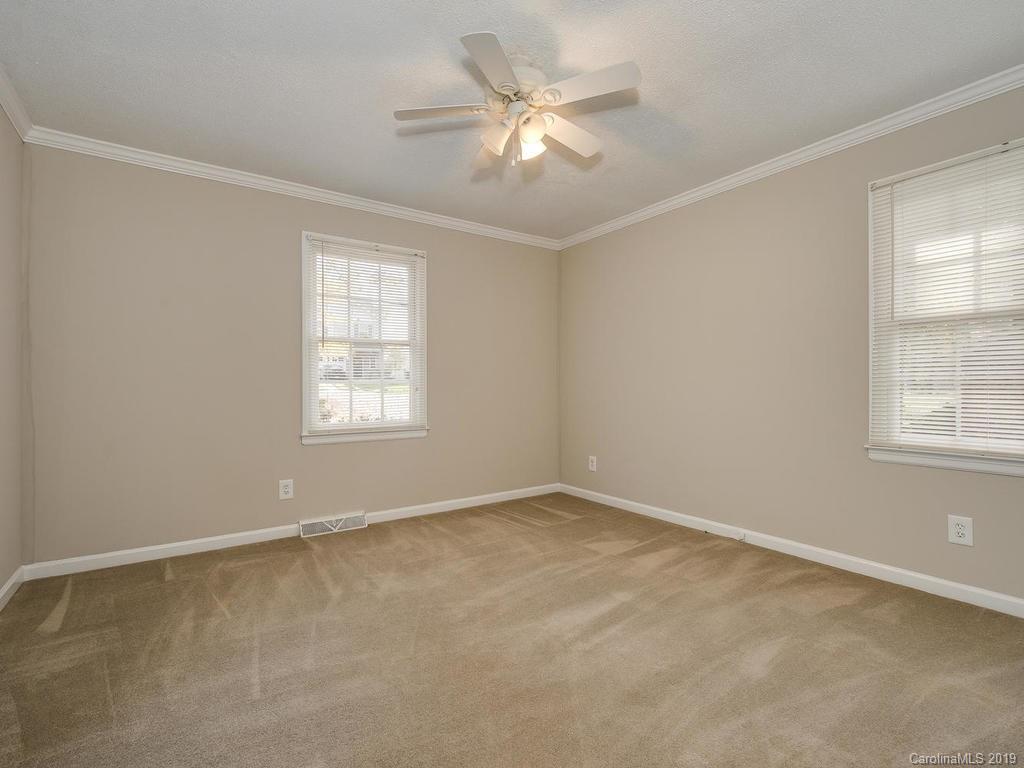 3310 Silver Stream Road, Unit 3310 Charlotte, NC 28226 - Photo 13 of 17 an empty room with windows and fan