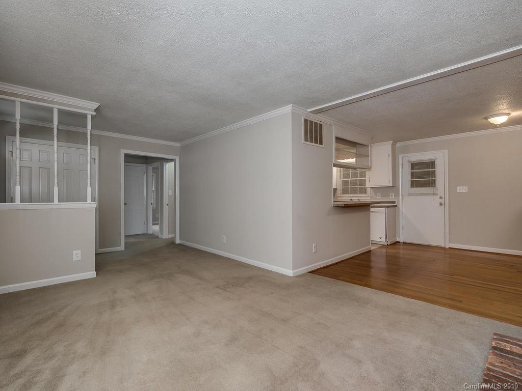 3310 Silver Stream Road, Unit 3310 Charlotte, NC 28226 - Photo 5 of 17 an empty room with windows and entrance