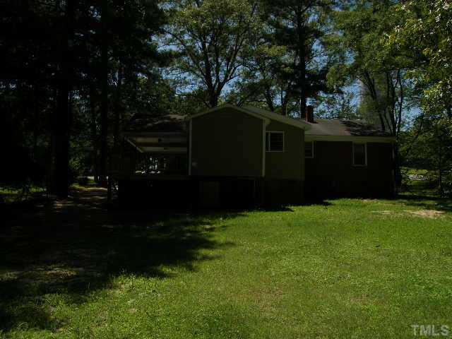 653 Sunnybrook Road Raleigh, NC 27610 - Photo 11 of 14 a front view of a house with garden
