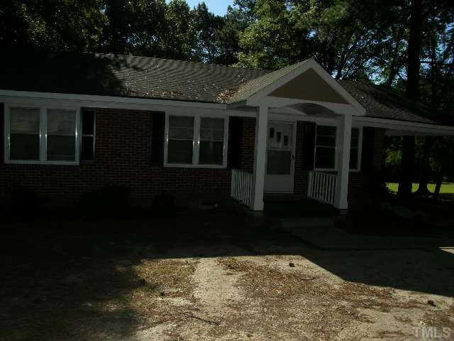 653 Sunnybrook Road Raleigh, NC 27610 - Photo 14 of 14 a front view of a house with a yard