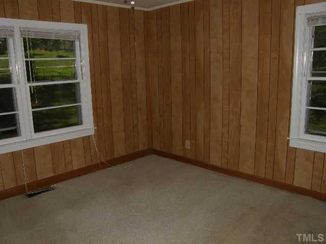 653 Sunnybrook Road Raleigh, NC 27610 - Photo 6 of 14 a view of an empty room with a window