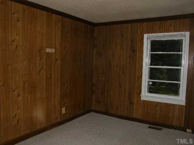 653 Sunnybrook Road Raleigh, NC 27610 - Photo 8 of 14 a view of an empty room with a window