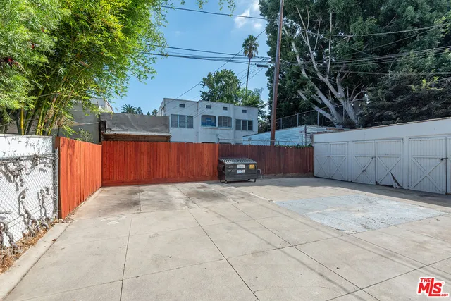 a car parked in front of white building