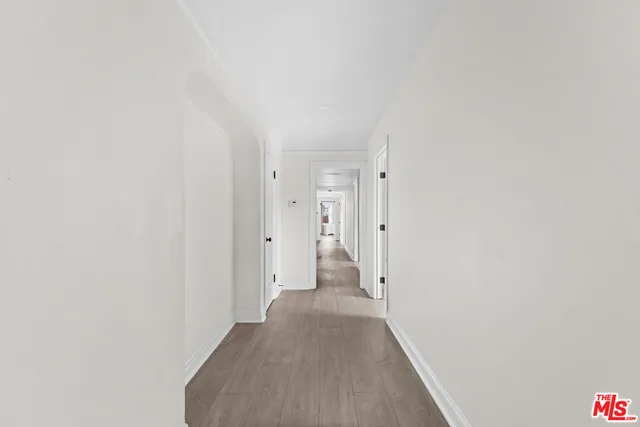 a view of a hallway with white walls