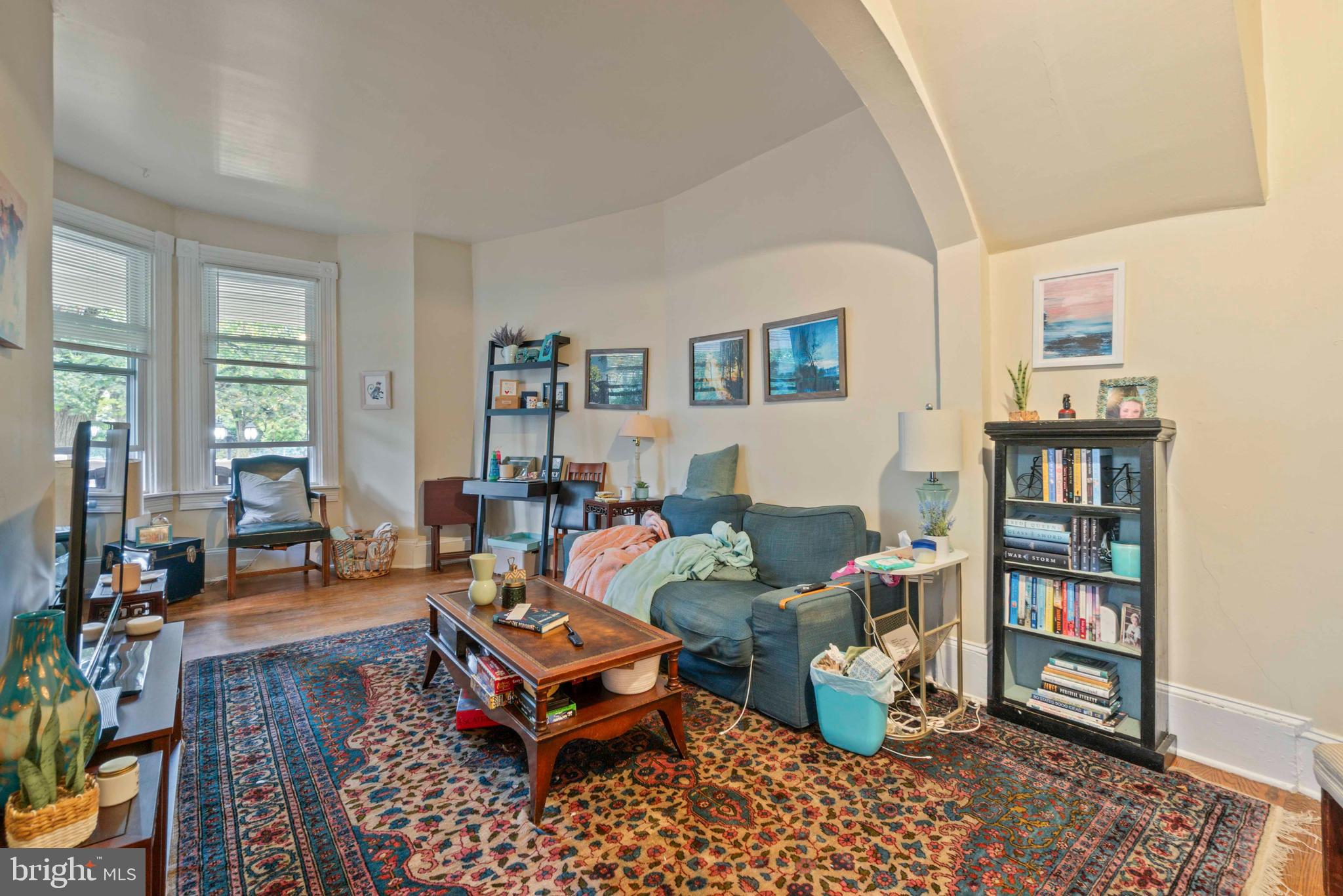 5009 Roland Avenue Baltimore, MD 21210 - Photo 11 of 35 a living room with furniture and a book shelf
