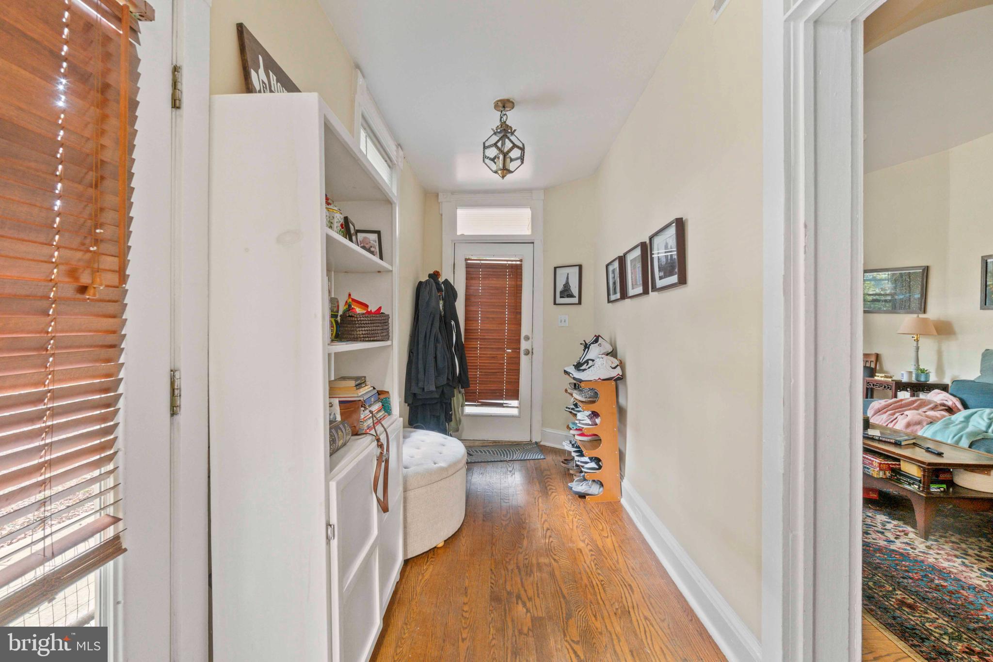 5009 Roland Avenue Baltimore, MD 21210 - Photo 12 of 35 a living room with furniture and a baby crib