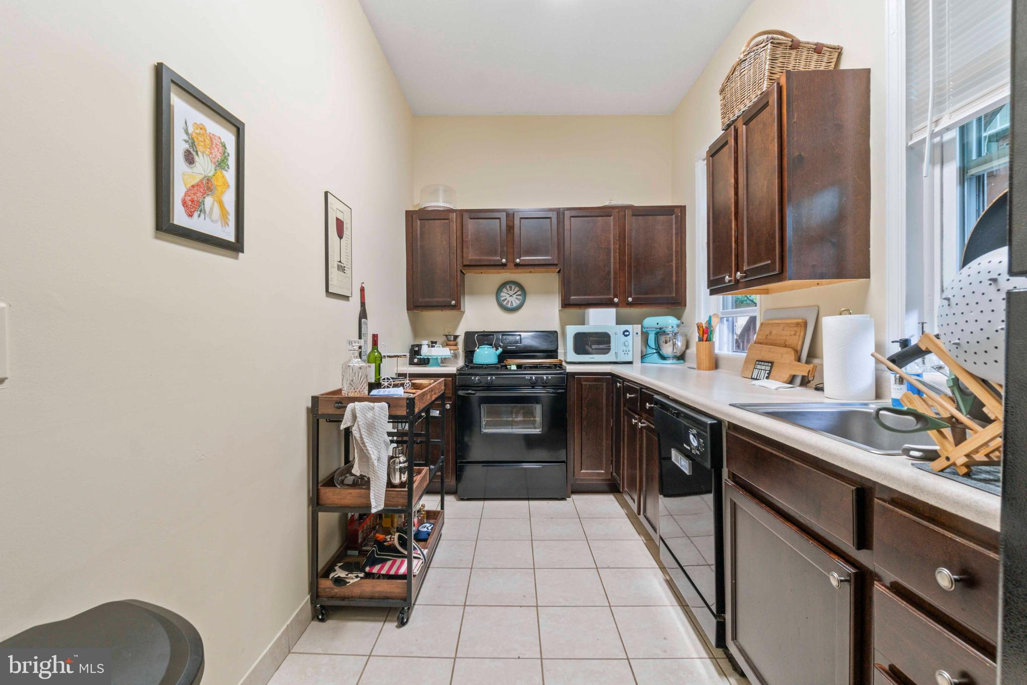 5009 Roland Avenue Baltimore, MD 21210 - Photo 13 of 35 a kitchen with a refrigerator and a stove
