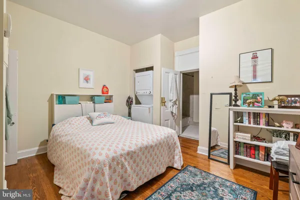 a view of walk in closet with clothes