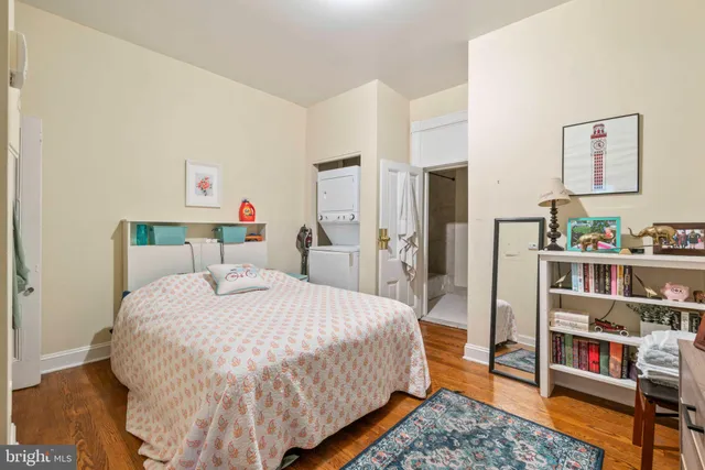 a view of walk in closet with clothes