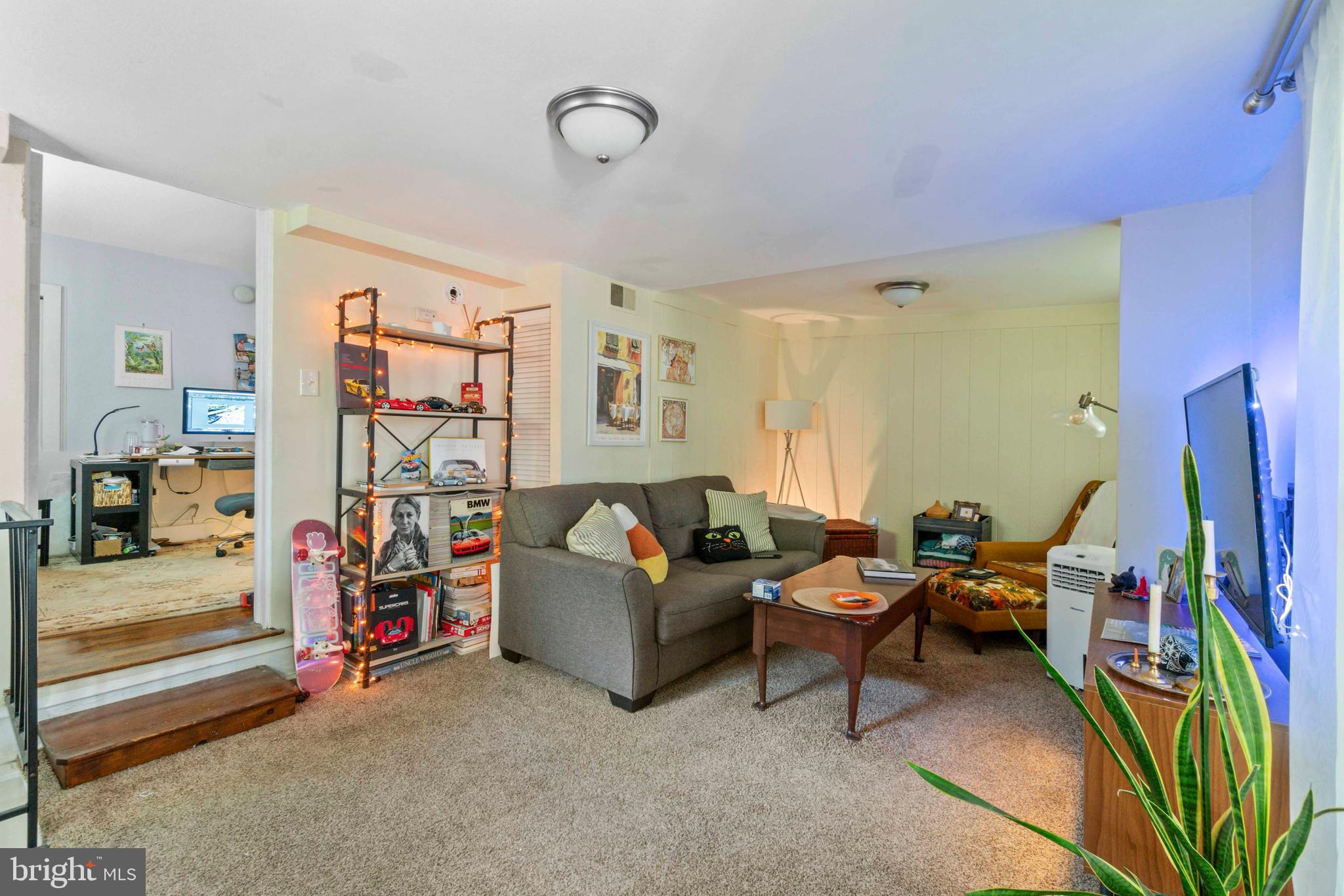 5009 Roland Avenue Baltimore, MD 21210 - Photo 19 of 35 a living room with furniture and a wooden floor