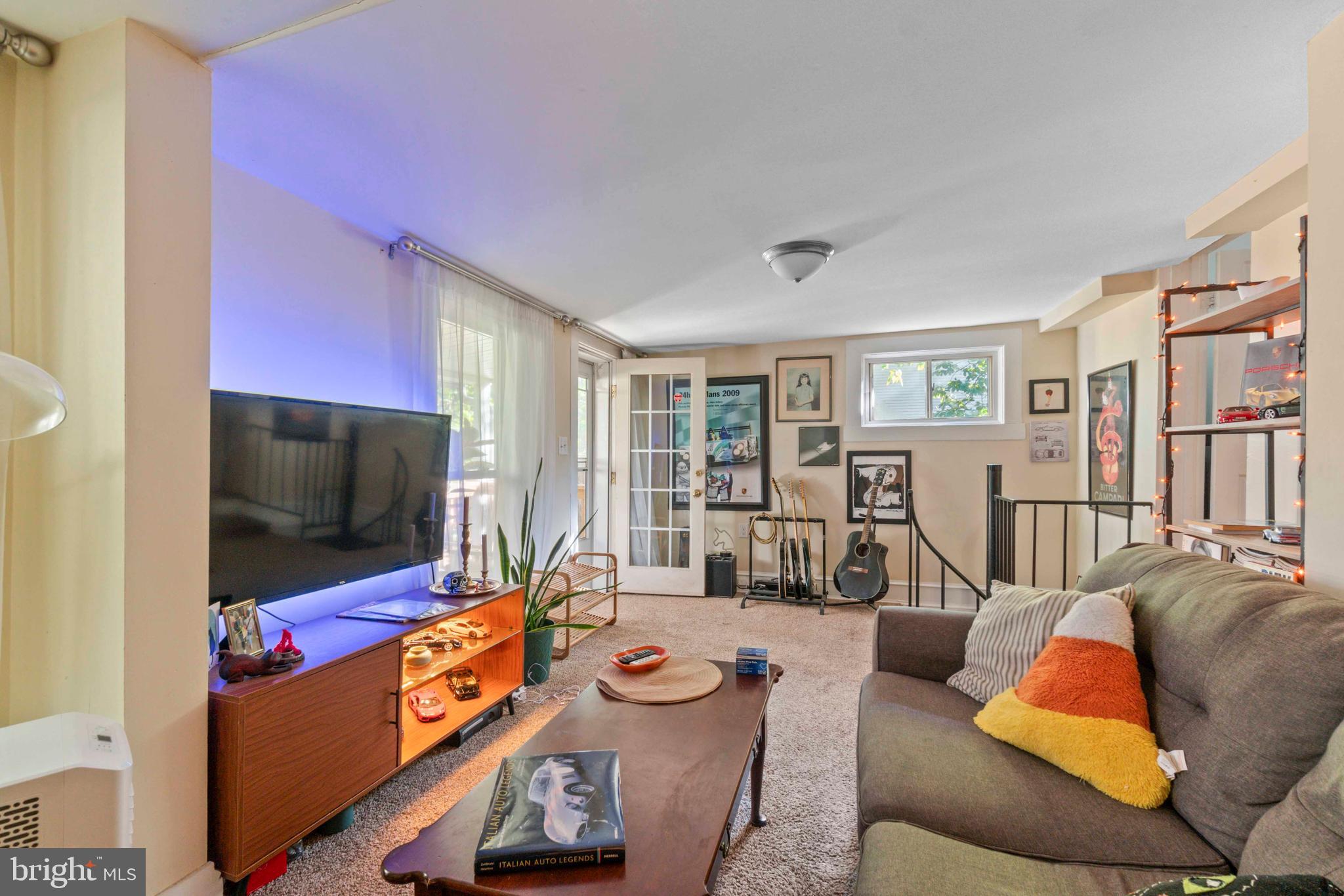 5009 Roland Avenue Baltimore, MD 21210 - Photo 20 of 35 a living room with furniture and a flat screen tv