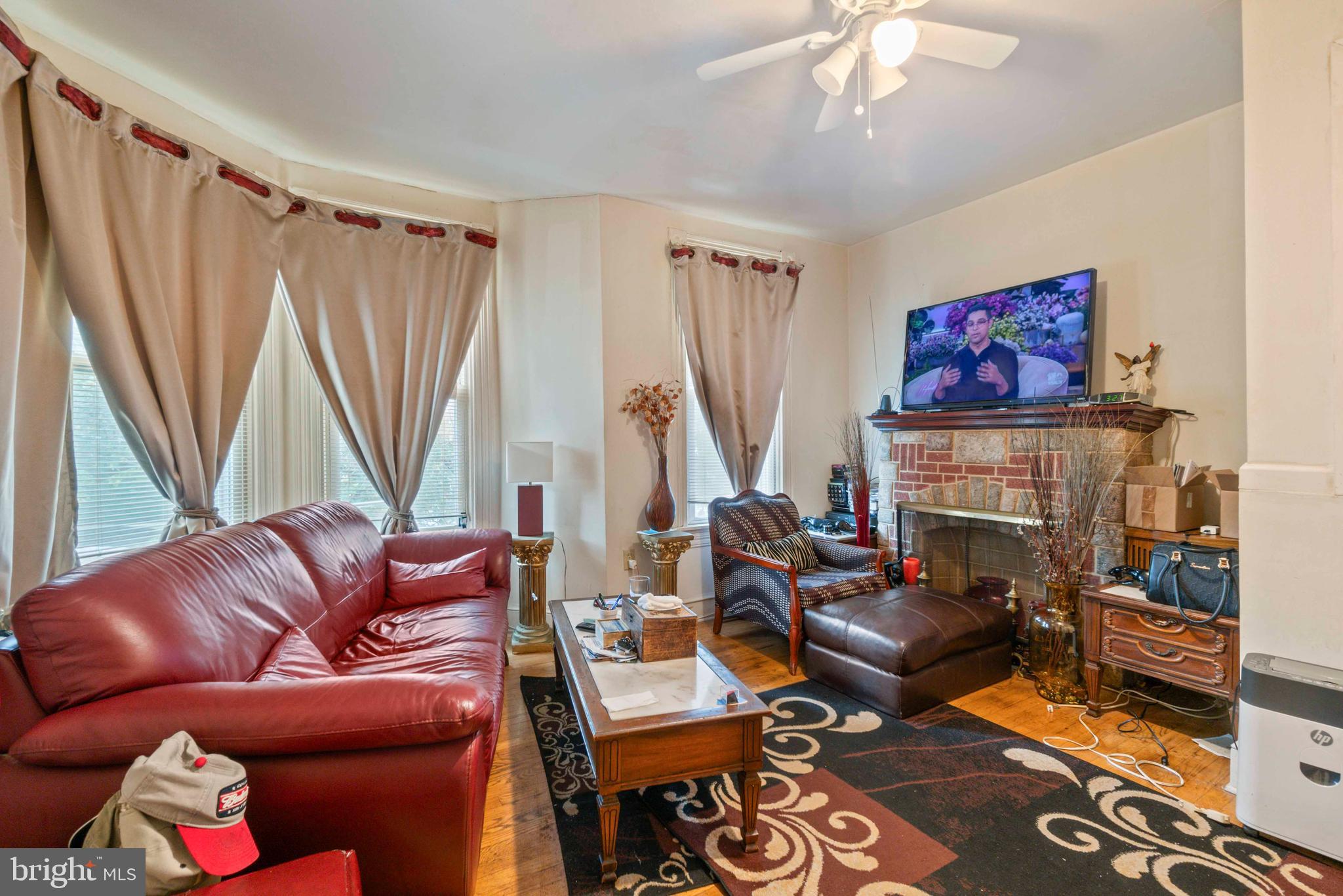 5009 Roland Avenue Baltimore, MD 21210 - Photo 2 of 35 a living room with furniture and a fireplace