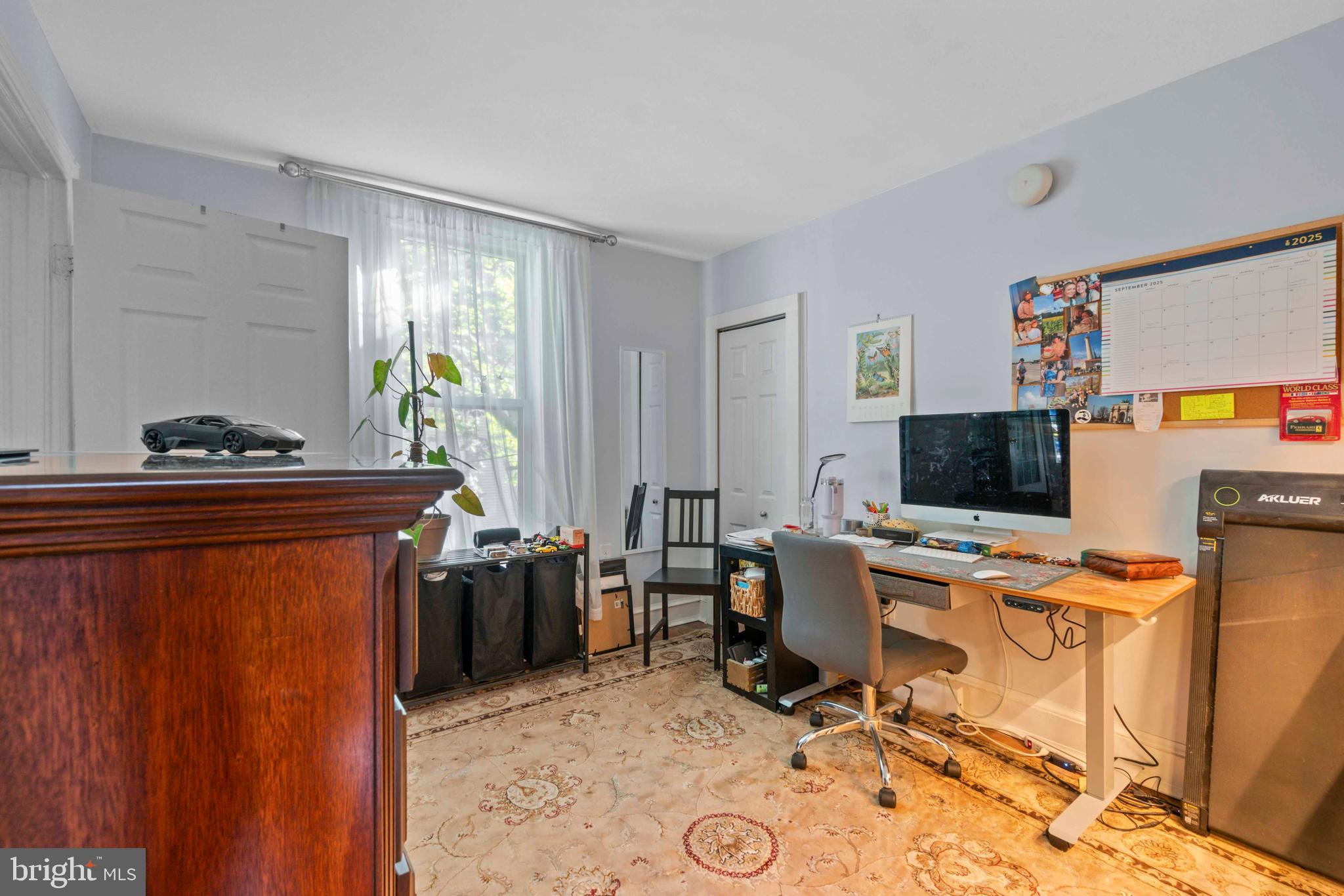 5009 Roland Avenue Baltimore, MD 21210 - Photo 24 of 35 a view of a workspace with furniture and a window