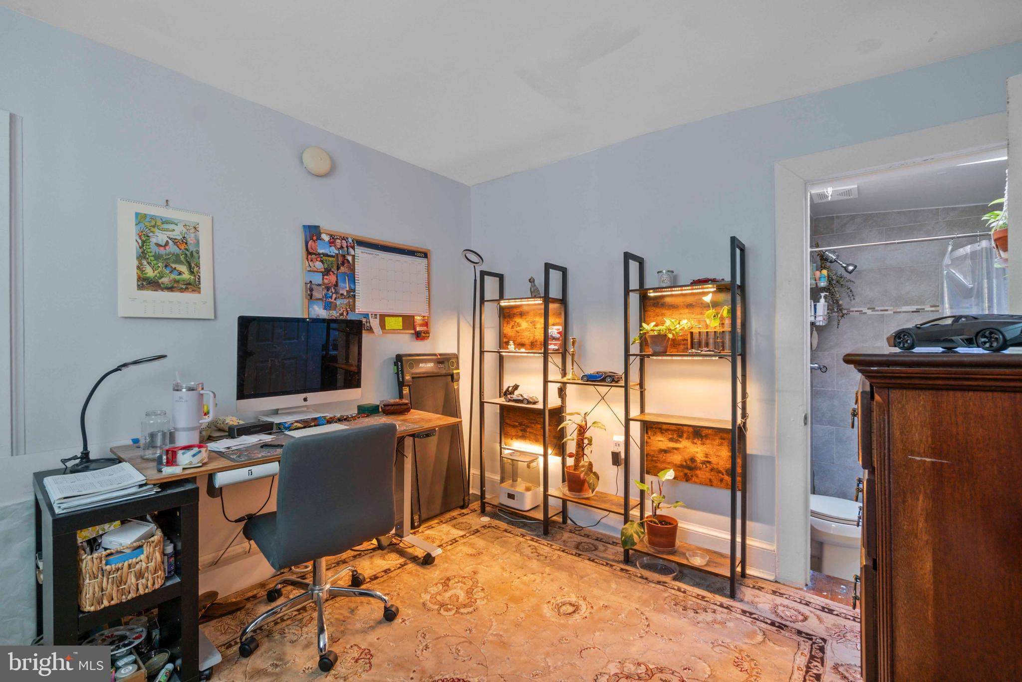 5009 Roland Avenue Baltimore, MD 21210 - Photo 25 of 35 a view of a workspace with furniture and a window