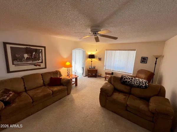 a living room with furniture and a window