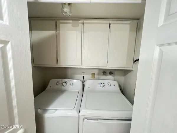 a utility room with dryer and washer