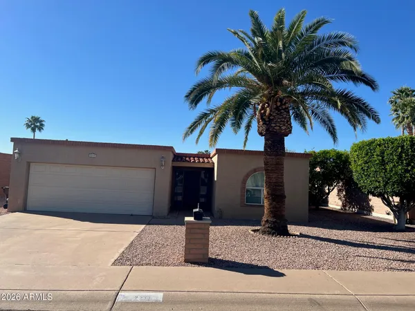 a front view of a house with tree s
