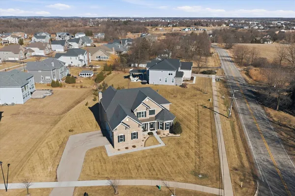 an aerial view of a house with a city view