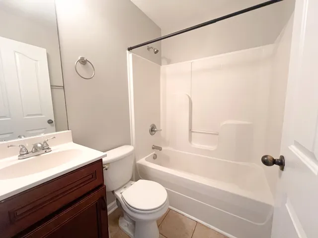 a bathroom with a sink a toilet and a bathtub