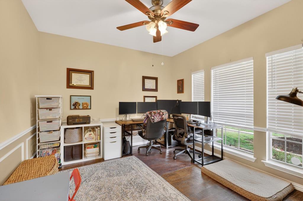 808 Mexicali Way Haslet, TX 76052 - Photo 3 of 25 Home office featuring dark wood-style floors and a ceiling fan