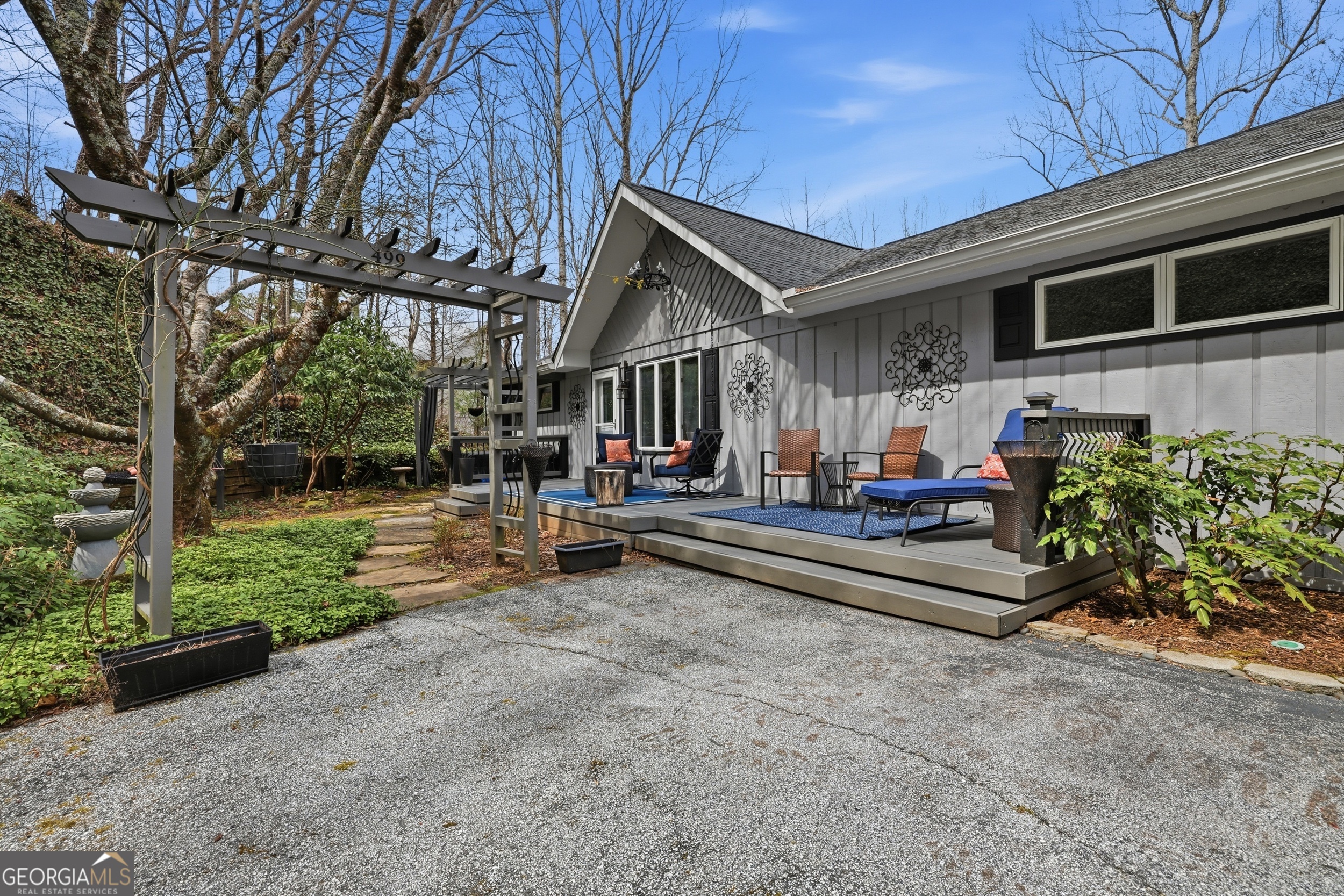 499 Ridgepole Drive Sky Valley, GA 30537 - Photo 58 of 58 a wooden bench sitting in front of a house