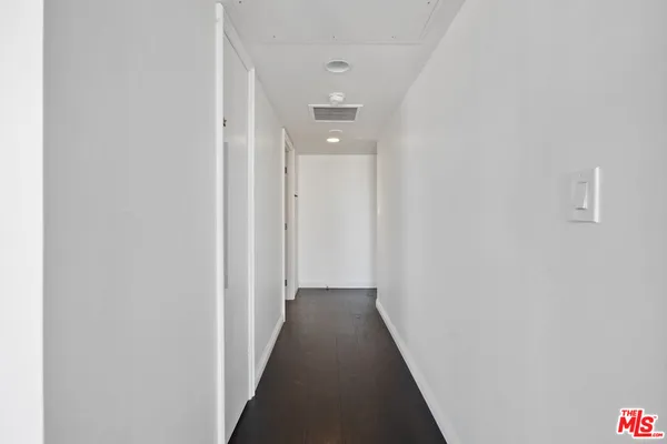 a bathroom with a tub and a toilet