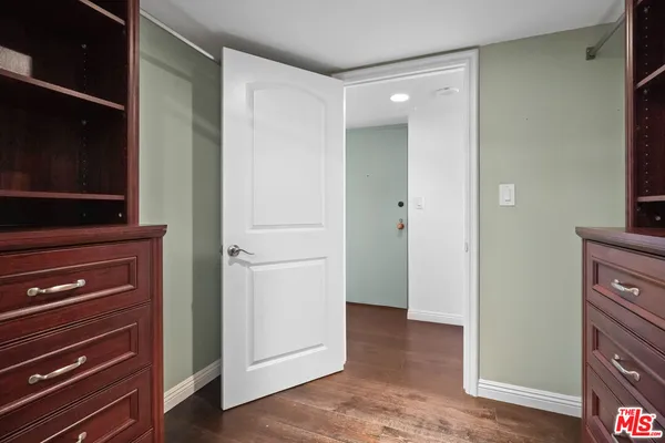 a view of bathroom with a wardrobe space