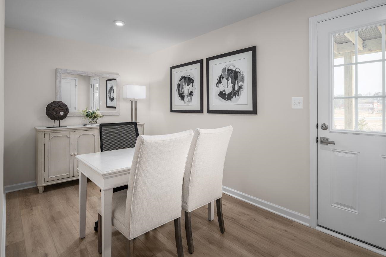 101 B Orchard Ridge Lane Harrisonburg, VA 22801 - Photo 12 of 14 a view of a dining room with furniture and wooden floor