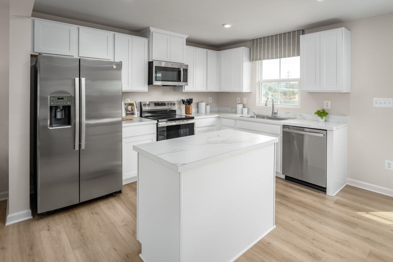 101 B Orchard Ridge Lane Harrisonburg, VA 22801 - Photo 3 of 14 a kitchen with a refrigerator sink and microwave