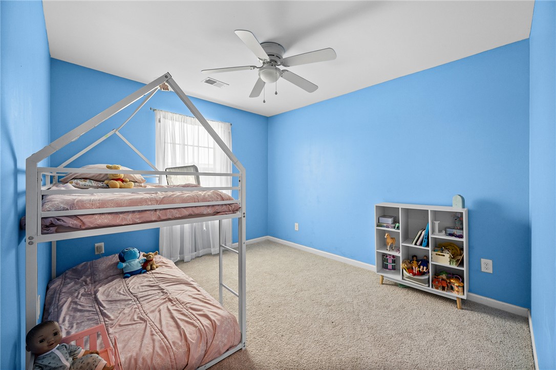 719 Camberwell Road Simpsonville, SC 29680 - Photo 22 of 47 A window bathes this bedroom in natural light while carpeted flooring grounds the space.
