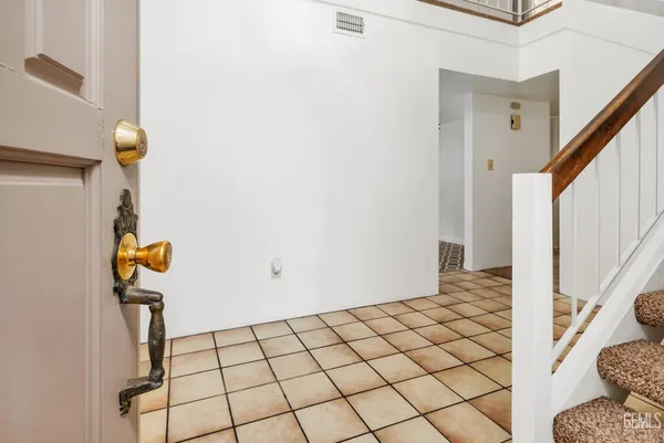 an empty room with a empty space and a window