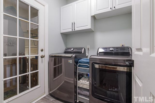 a stove top oven sitting inside of a kitchen