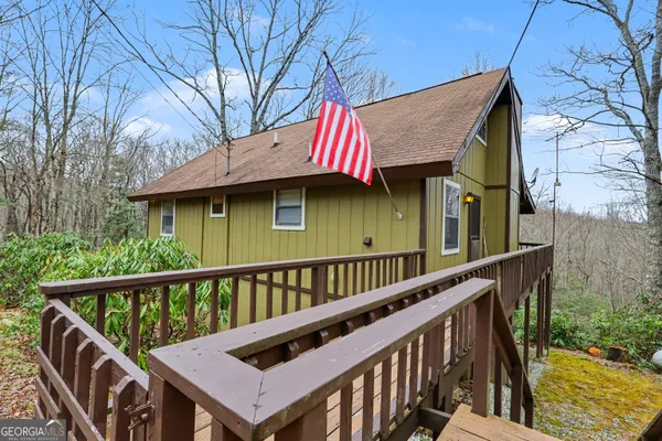 a kitchen with stainless steel appliances granite countertop a stove a sink a microwave dining table and chairs