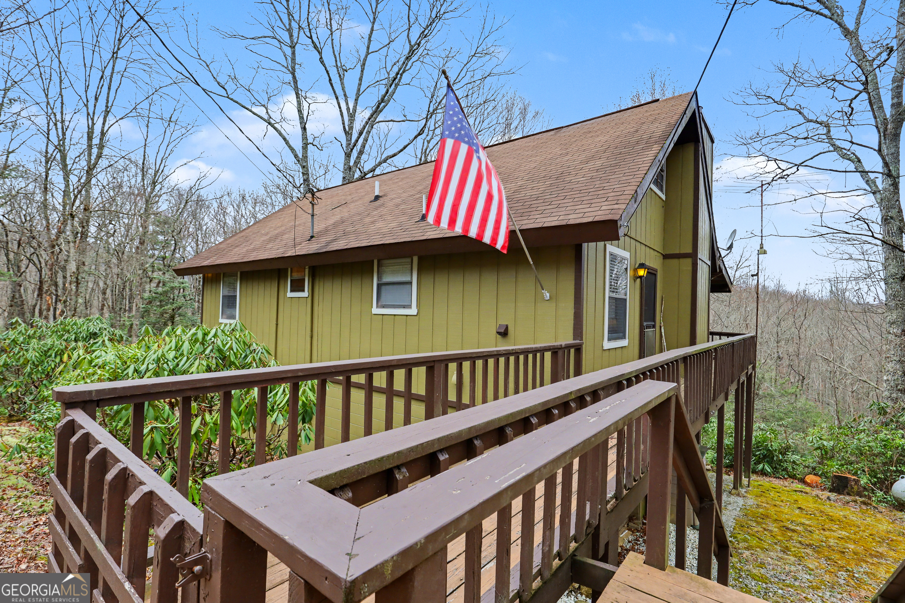 559 Maple Leaf Drive Dillard, GA 30537 - Photo 4 of 49 a view of a wooden deck and a backyard