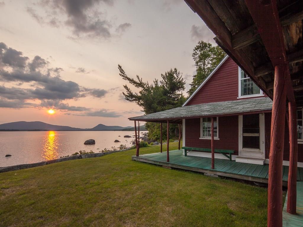10 Upper Dam Road Oquossoc, ME 04964 - Photo 26 of 35 setting sun by the ladies' cabin