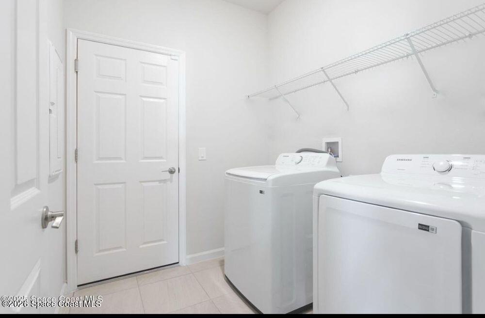 2792 Pinwherry Street Palm Bay, FL 32907 - Photo 14 of 19 a utility room with dryer and washer