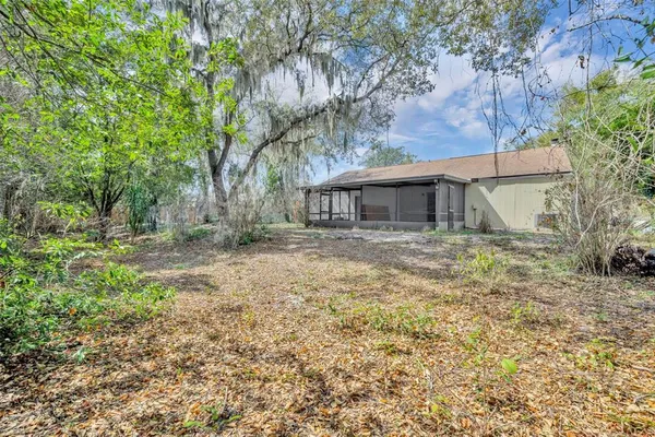 a house view with a backyard space