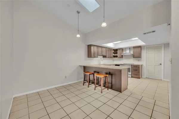 a kitchen with a sink cabinets and window
