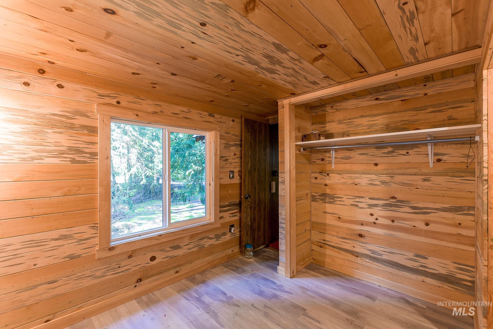 1206 Idlers Rest Road Moscow, ID 83843 - Photo 18 of 47 Room featuring natural wood plank walls, ceiling, and trim