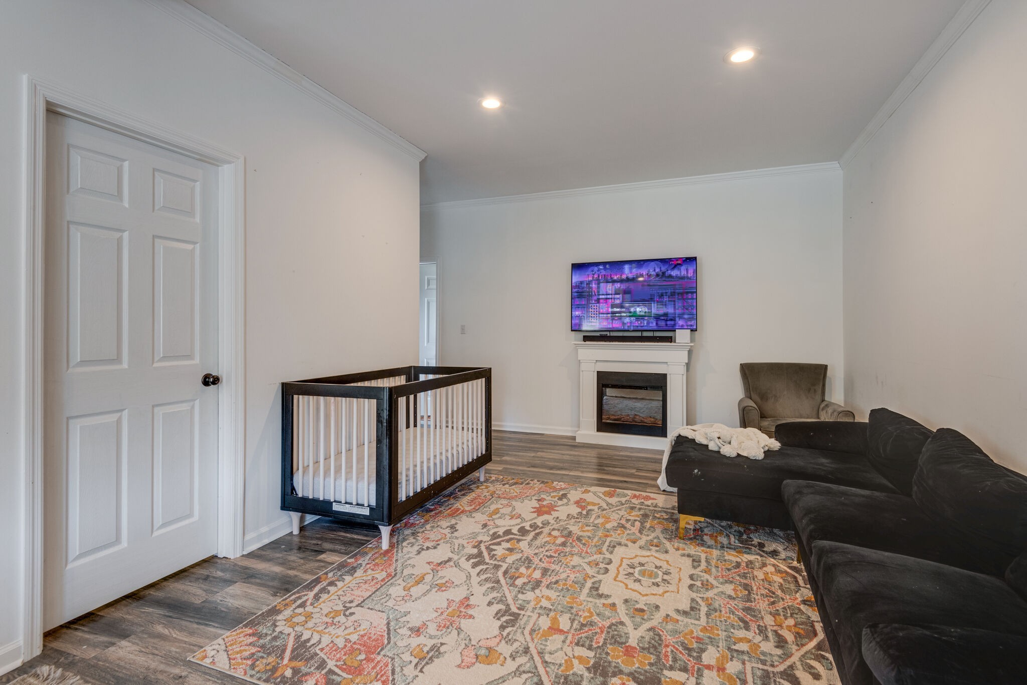 111 Meadowood Loop Burns, TN 37029 - Photo 55 of 73 a living room with furniture a fireplace and a flat screen tv