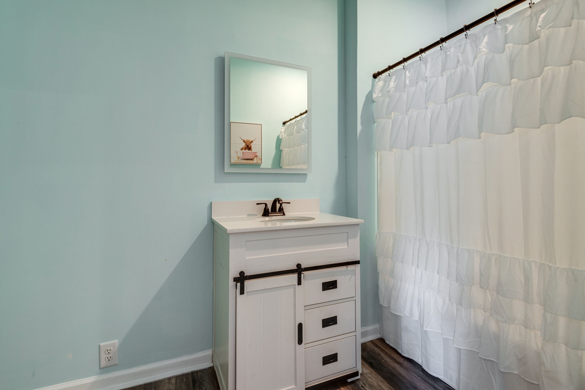 111 Meadowood Loop Burns, TN 37029 - Photo 56 of 73 a bathroom with a sink a vanity and a mirror