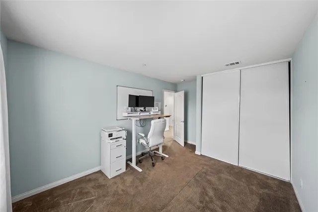 a view of a workspace with furniture