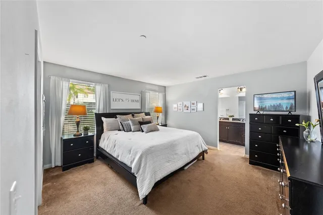 a bedroom with a bed and dresser