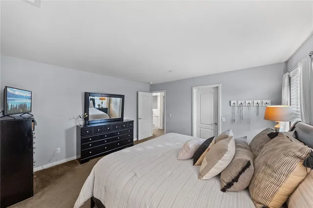 a bedroom with a bed and dresser