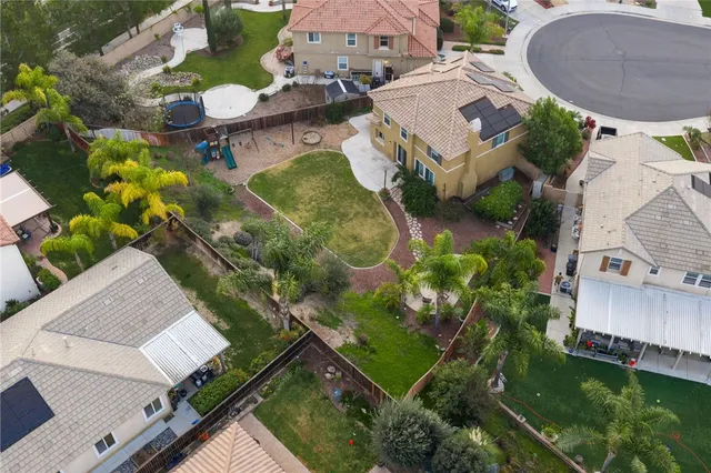 an aerial view of a house with outdoor space